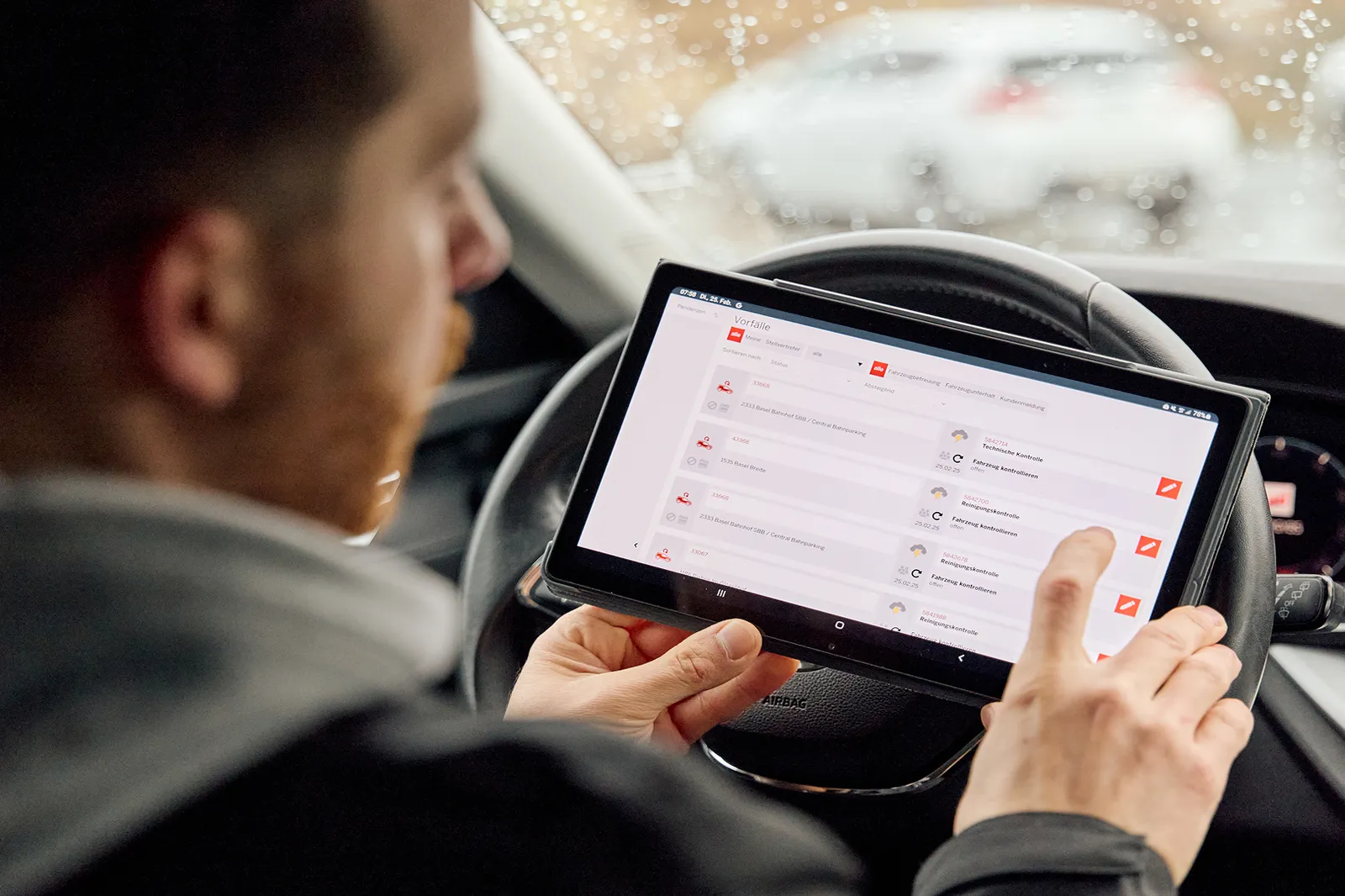 ServiceMobiler using a tablet to find vehicle information.